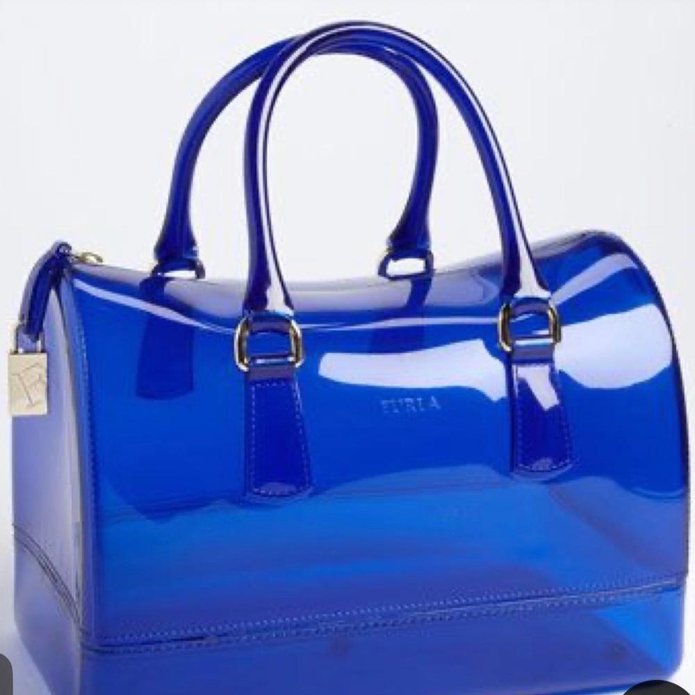 Girls blue jelly bag, in duster bag. Price negotiable!
